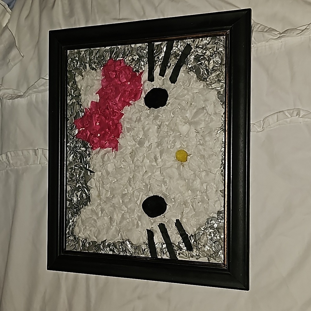 Hello Kitty decor. Wall art or decor accent piece. Framed in a black wood frame.